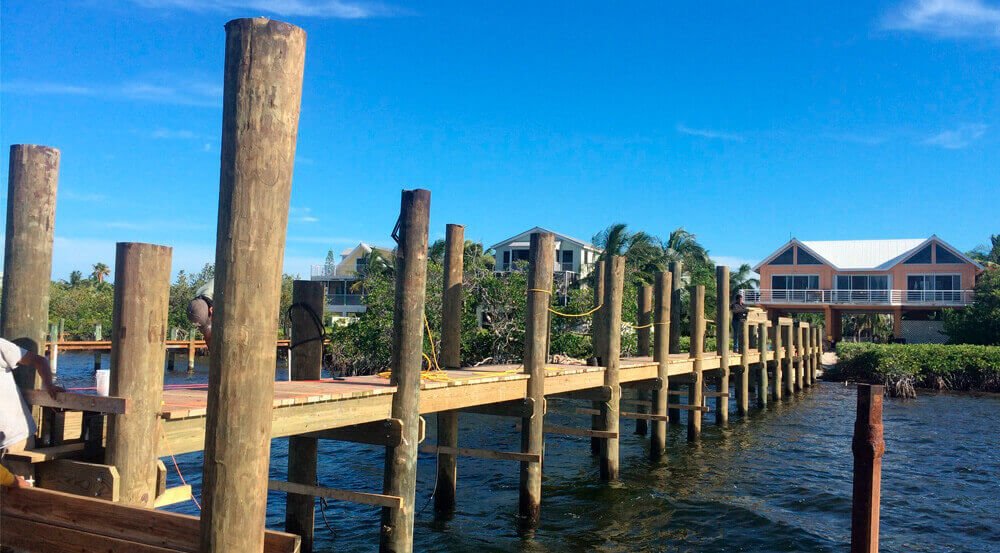 https://cdn.hibuwebsites.com/abba4b2bfe554ab6b458b84ac367b44b/dms3rep/multi/dock-piling-installation.jpg